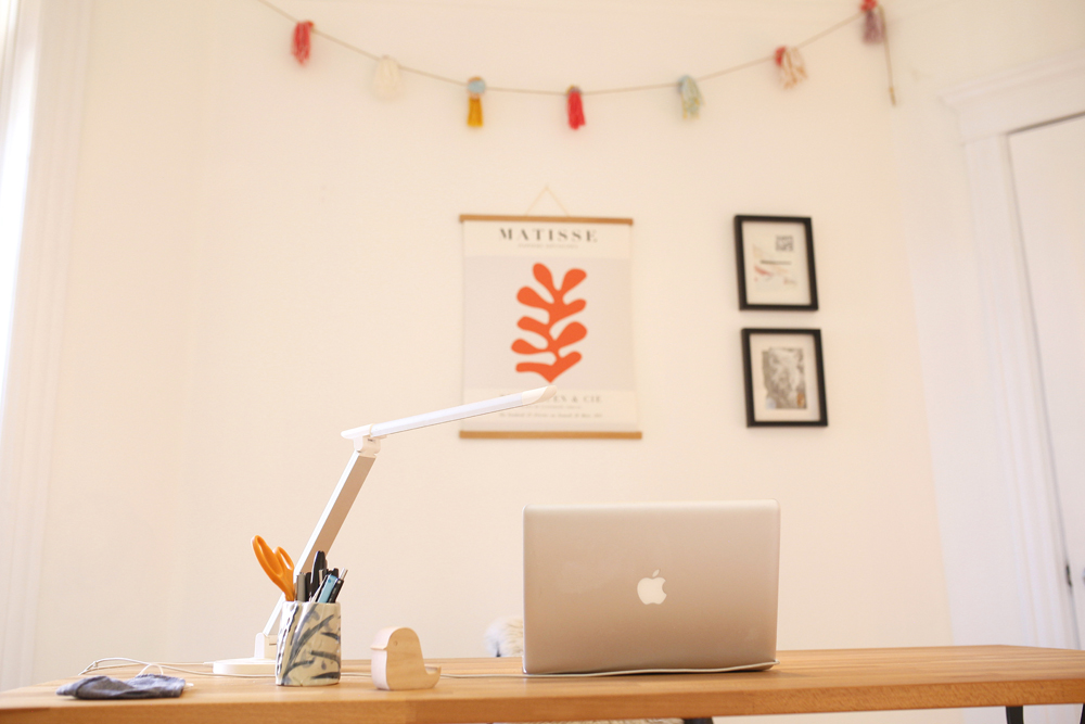 apple laptop, desk, orange matisse poster