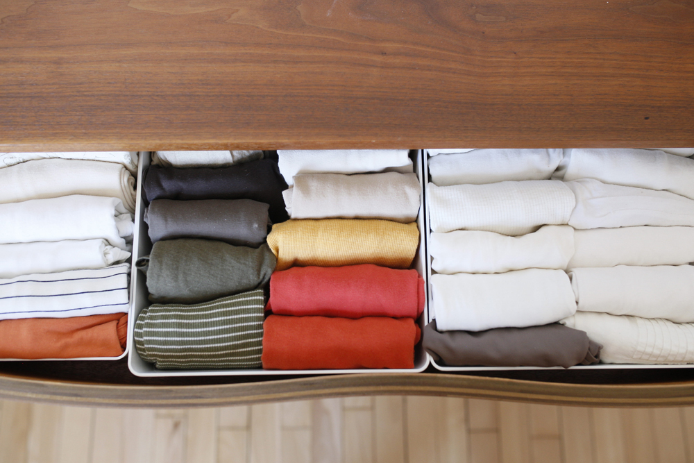 perfectly folded clothes in organized drawer