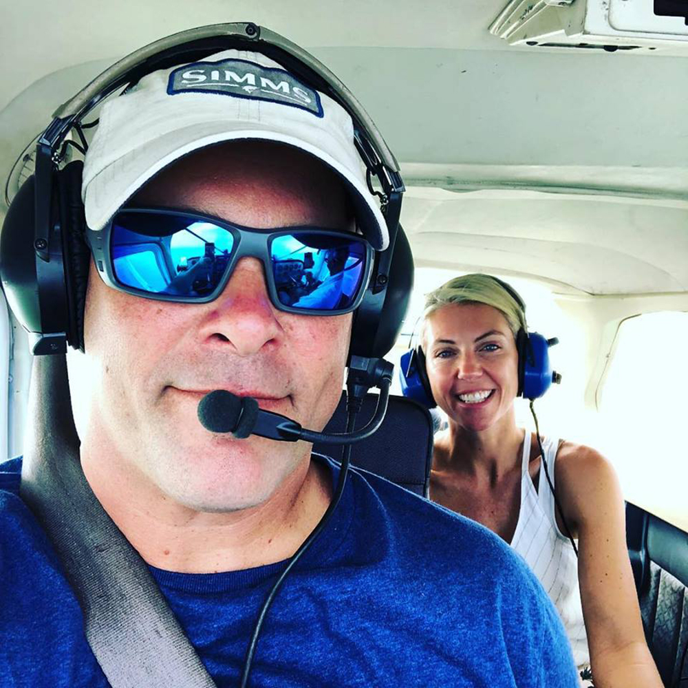 Bryan and Sarah Baeumler in an airplane