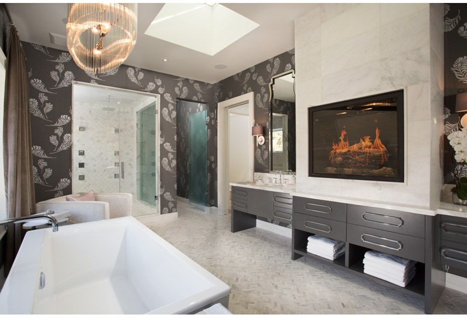 Modern and elegant bathroom with a tub and fireplace
