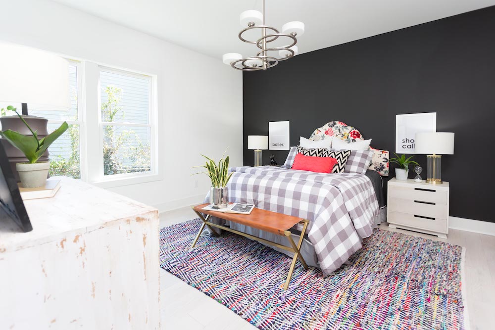 Masters of Flip bedroom with a colour rug and a black and white wall