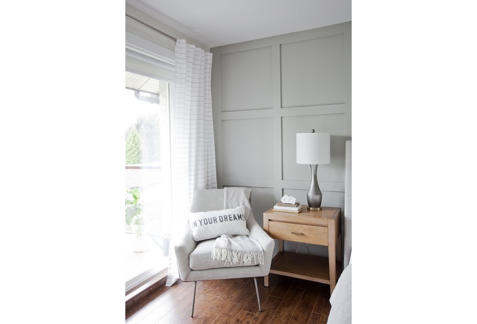 White arm chair in a white bedroom
