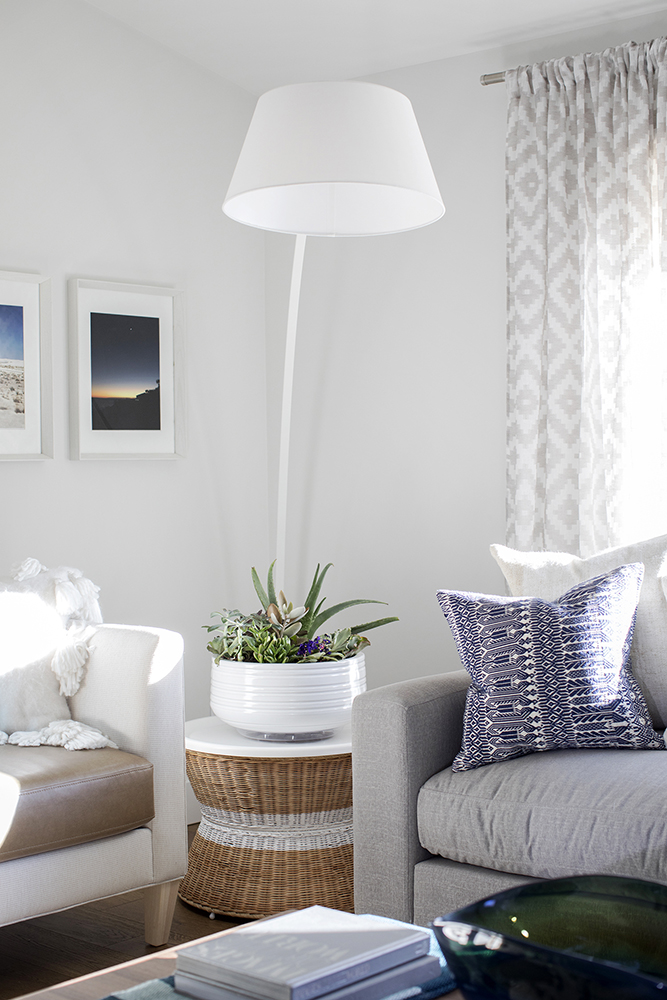 Modern living room corner with a large white floor lamp