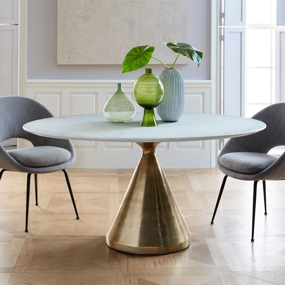 Pedestal dining table with marble top and gold base