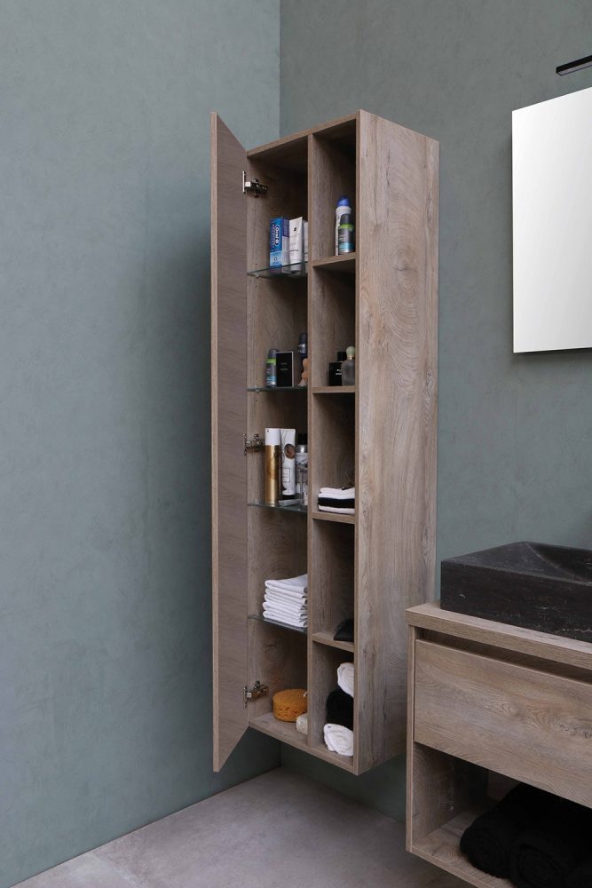 A sleek grey cabinet in a bathroom is slightly open.