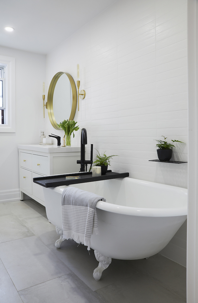modern white bathroom with clawfoot bathtub