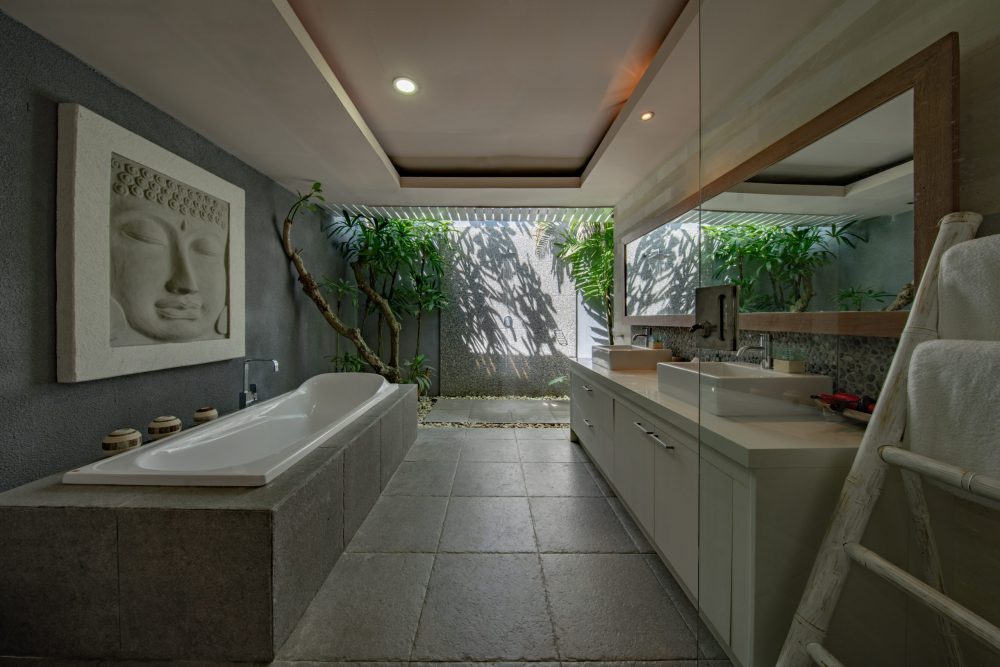 zen bathroom with concrete floor and outdoor shower attached