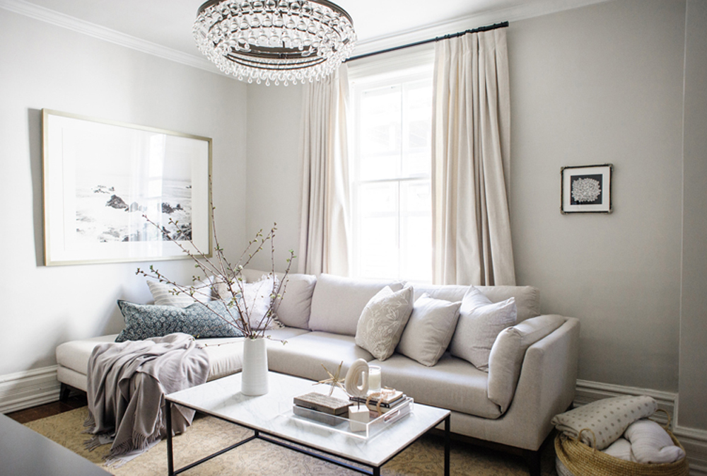 Living room with neutral tones and plenty of throw pillows