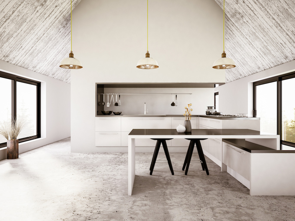 An industrial-inspired kitchen with cement floors, linear lines and pendant lights