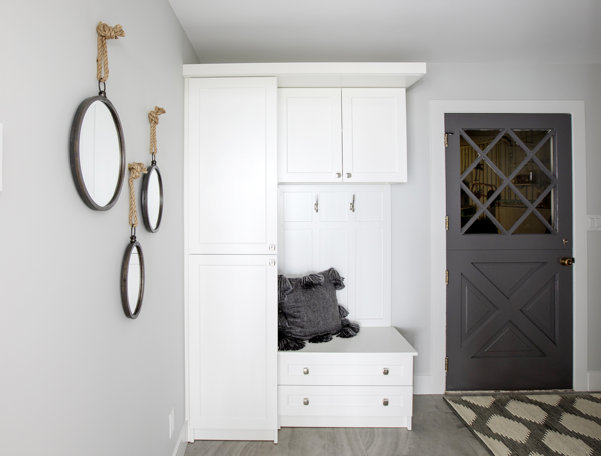 A built-in cabinet is a great way to keep coats, hats and scarves out of view.