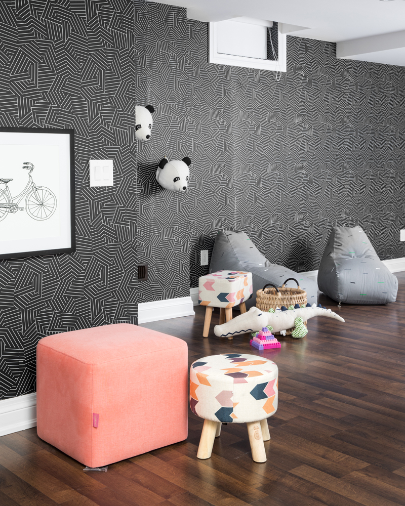Basement playroom with wallpaper and pandas on wall