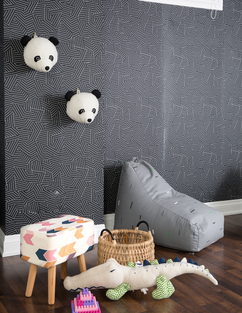 Basement playroom closeup of wall pandas and stool and toys on floor