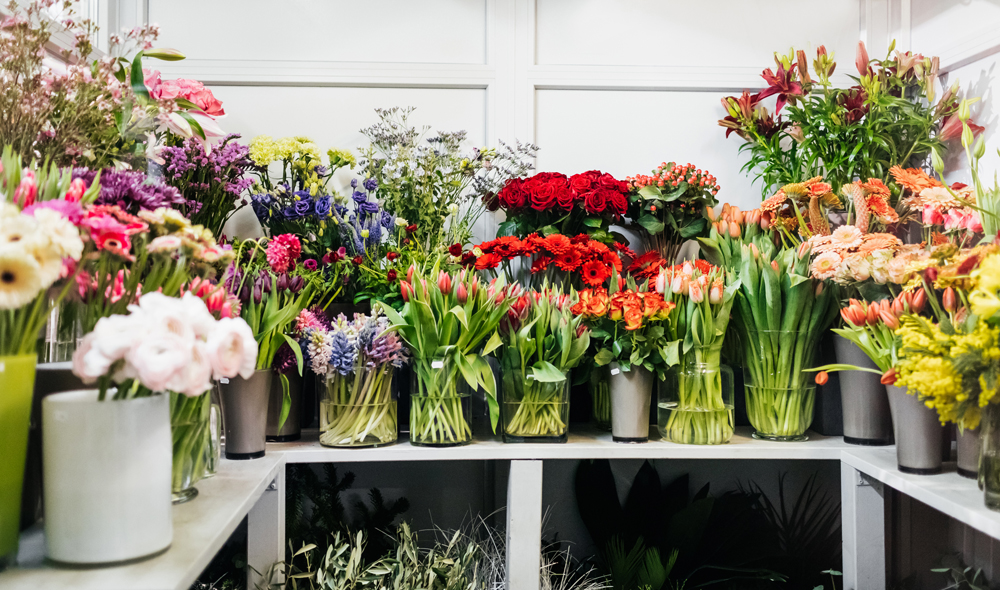 A variety of flower arrangements and bouquets in a shop