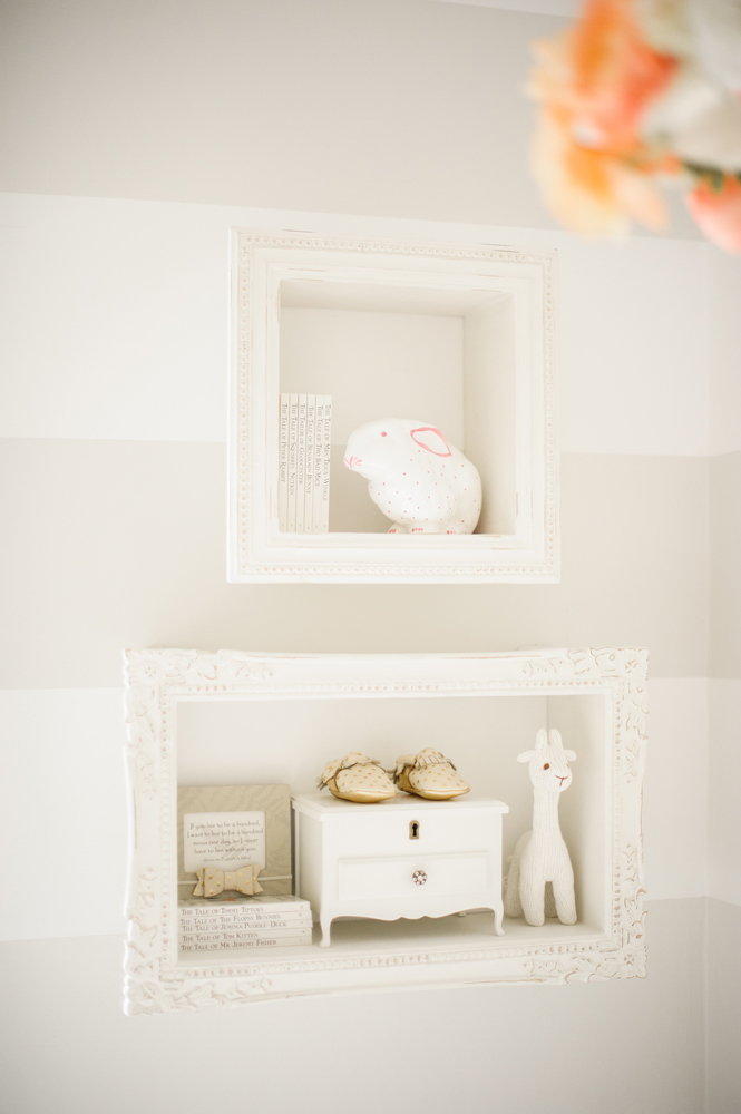 Vintage hand-carved displaying shelving in sweet girl's room.