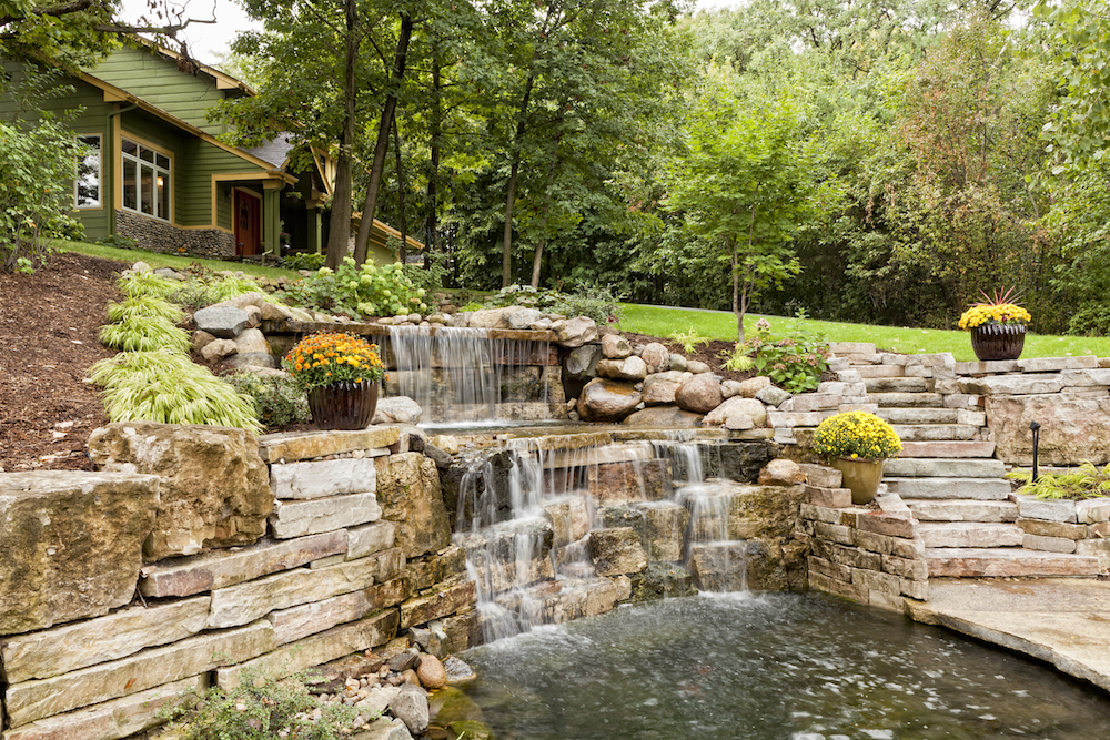 landscaped backyard waterfall