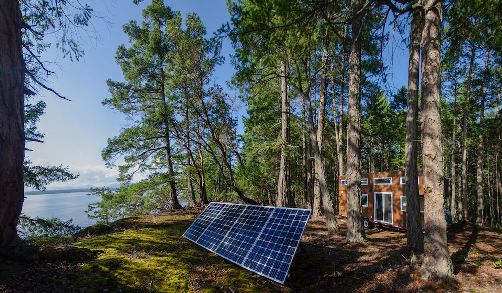 tiny house and solar panel in forest