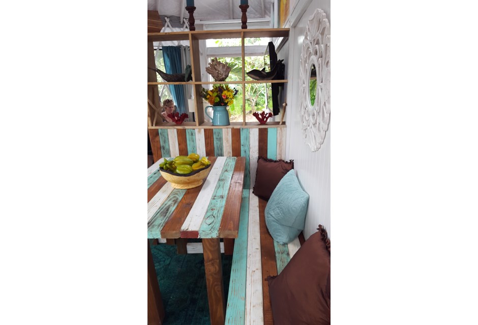 colourful striped dining area in tiny house