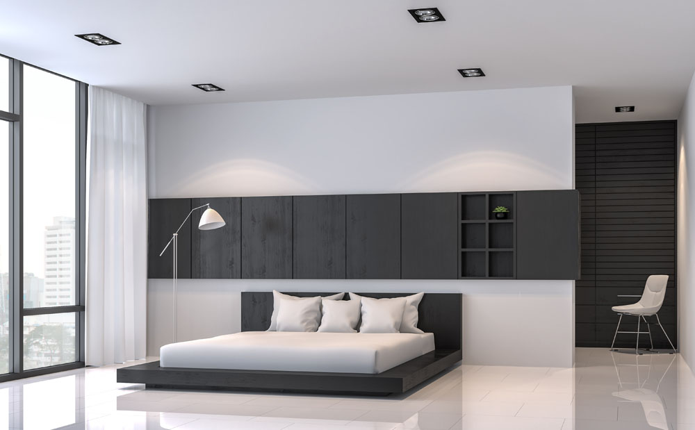 Ultra minimal black and white condo bedroom with large floor-to-ceiling windows