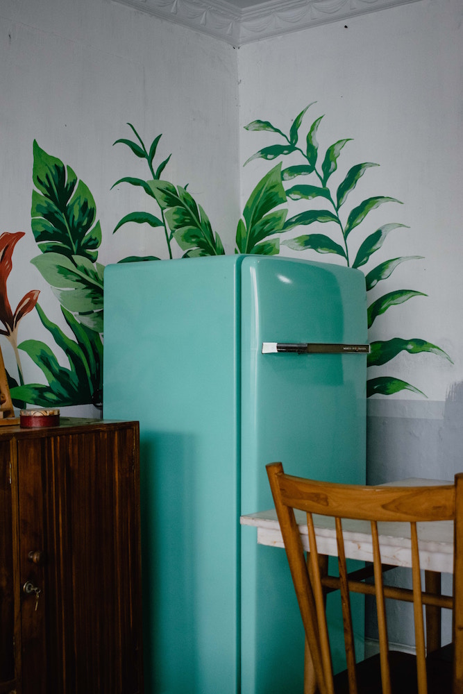 turquoise fridge in kitchen with wallpaper