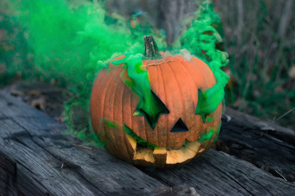 orange pumpkin with green smoke