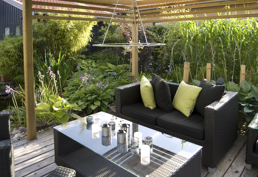 modern outdoor living area with wicker sofas and table