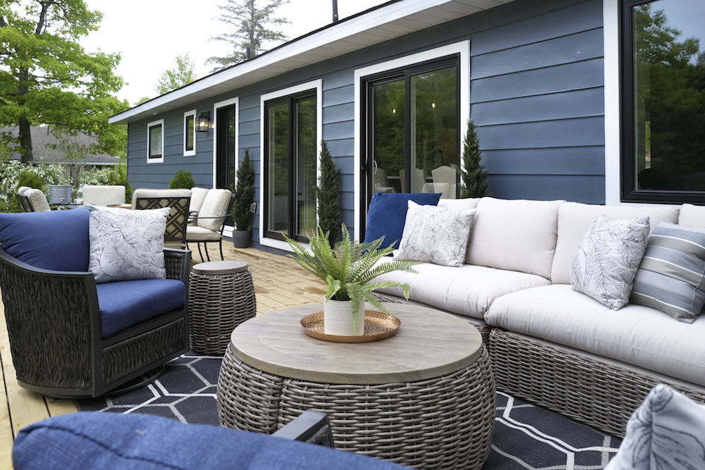 Outdoor seating area with grey and blue furniture
