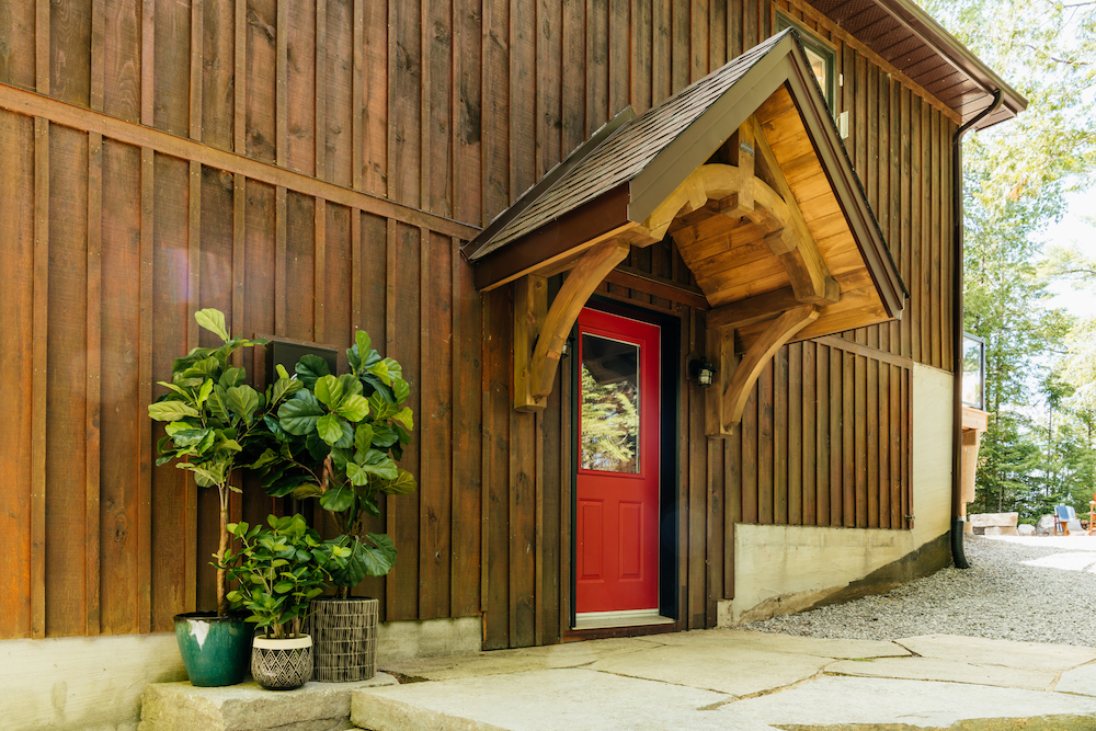 Red cottage door with portico