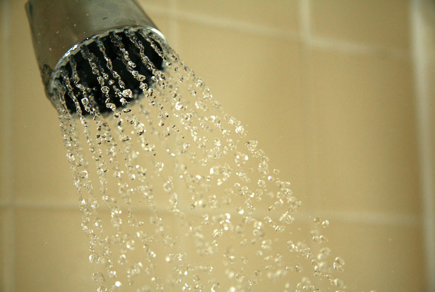 Remove hard water buildup from showers with this simple hack: Fill a plastic bag with vinegar, immerse the showerhead within the bag and fix the bag in place with a rubber band. After an hour, remove the bag and turn on the shower to its hottest setting to flush it out. Polish with a soft cloth.