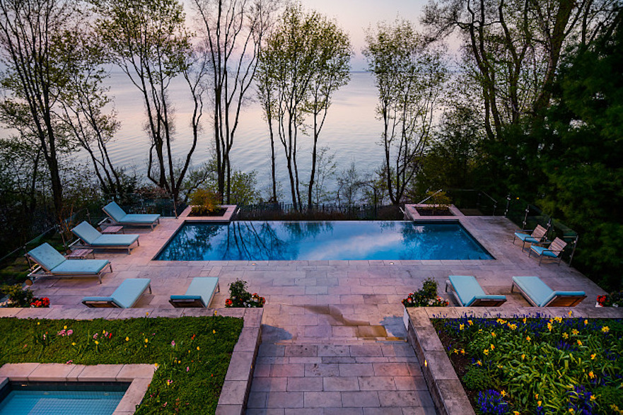 Pool deck of mid-century modern Toronto-area lakefront home