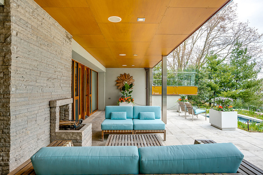 Covered outdoor deck area of mid-century modern Toronto-area lakefront home