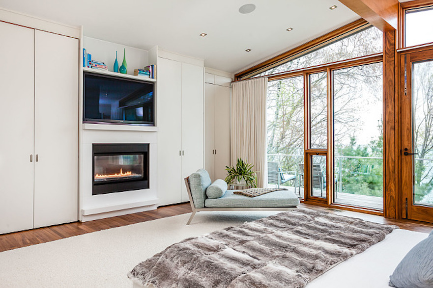 Master bedroom fireplace of mid-century modern Toronto-area lakefront home