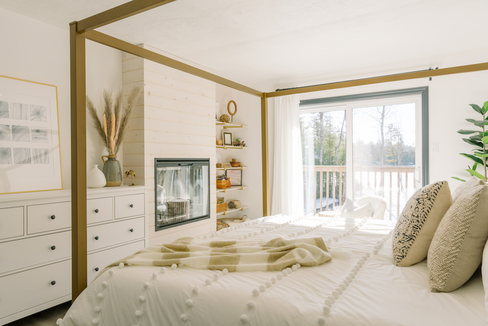 White and gold bedroom with fireplace