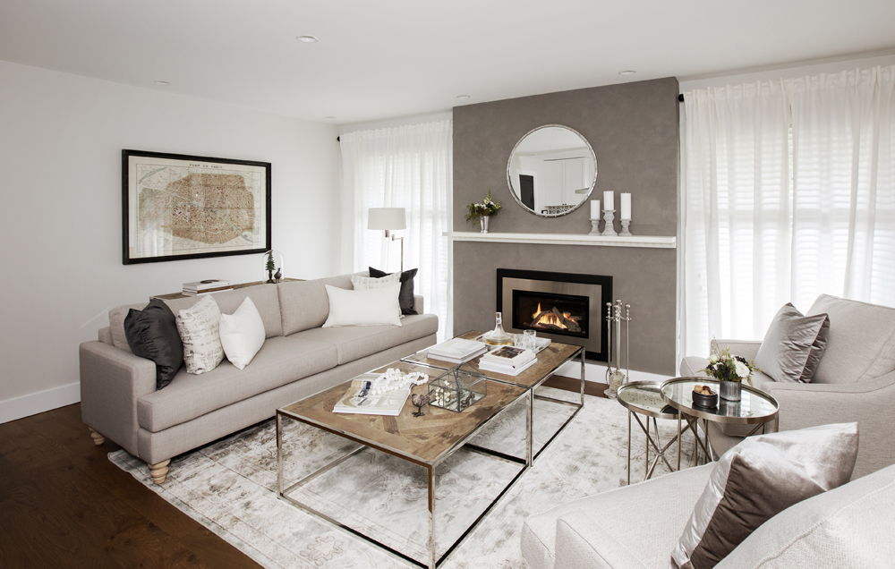 Modern living room with serene monochromatic palette.