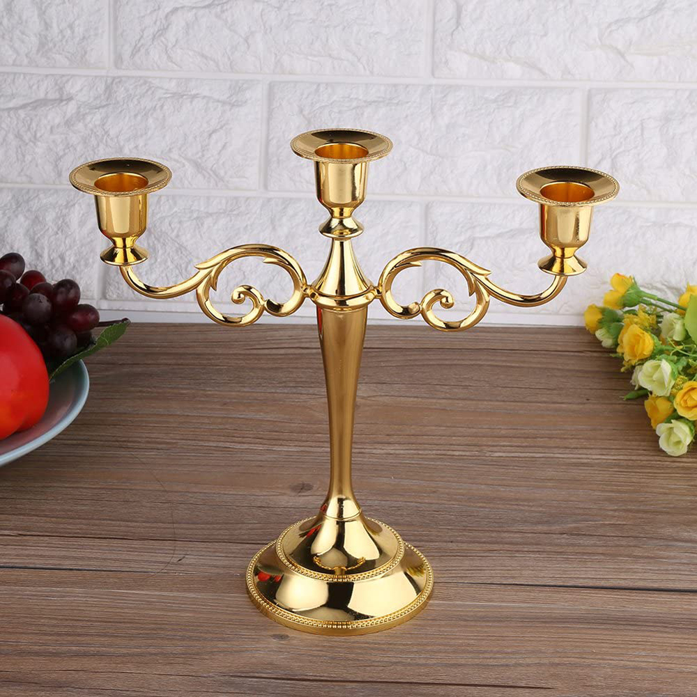 A shiny gold candelabra on a kitchen table