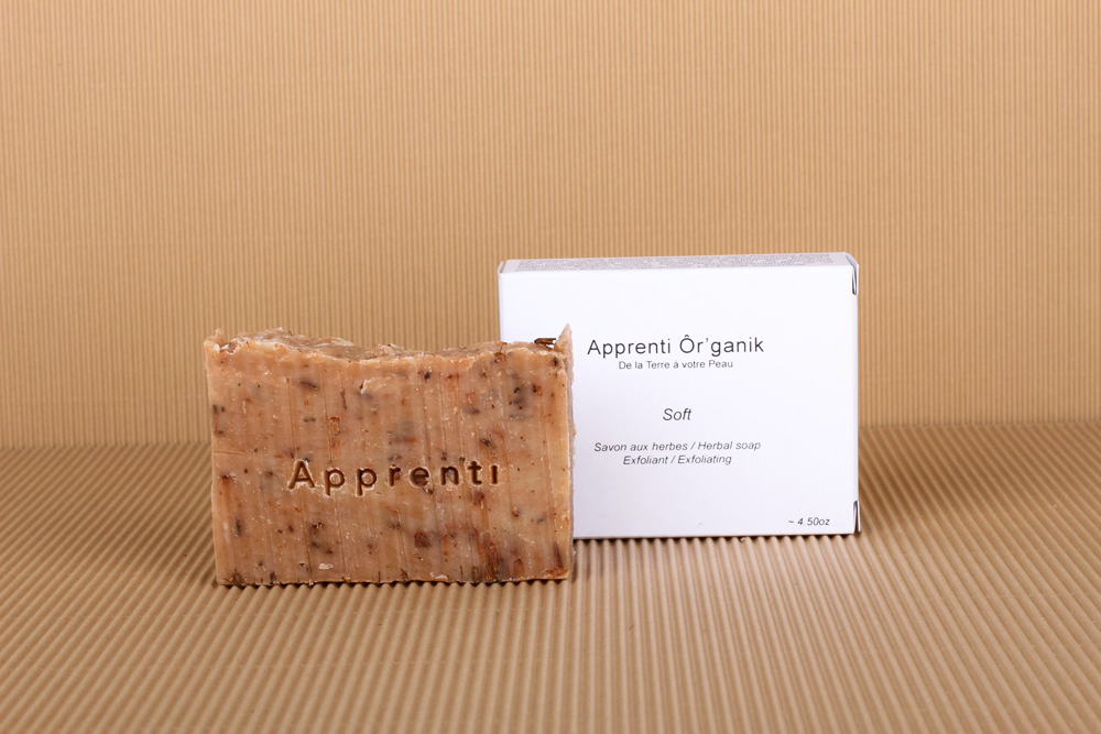 A large piece of handmade soap displayed next to its box