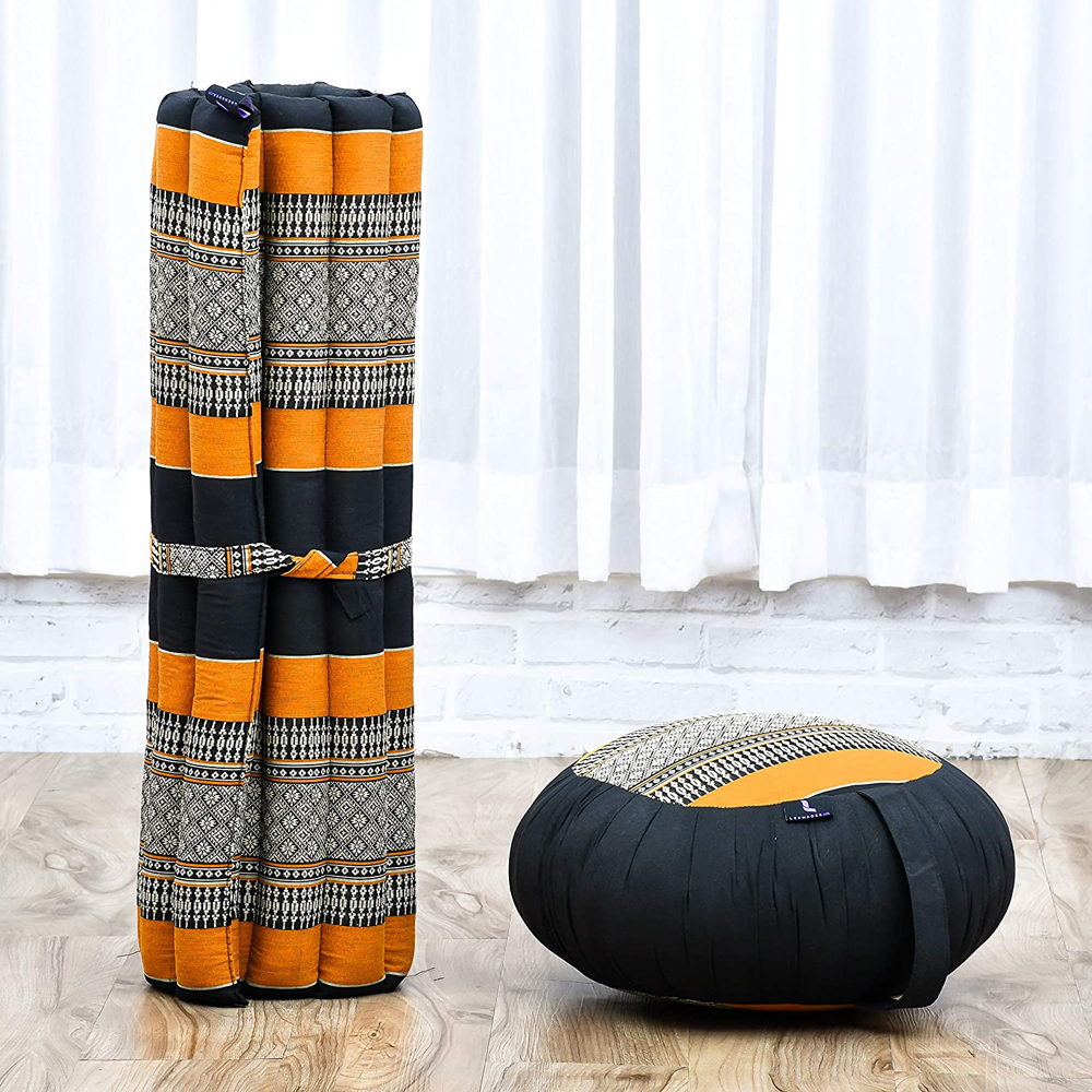 A patterned meditation cushion set, in oval and roll-up rectangular shapes