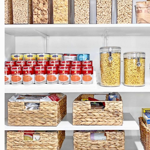 Clear containers and straw basket in a pantry