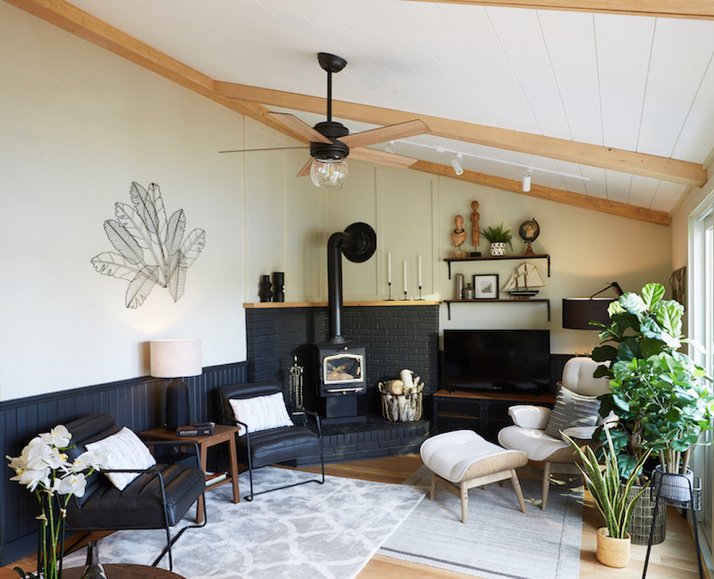 Cabin-inspired living room with bright white shiplap, faux wood beams and black metal and wood ceiling fan in Muskoka, Ontario, as seen on Scott’s Vacation House Rules on HGTV Canada