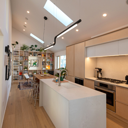 The open kitchen with white island