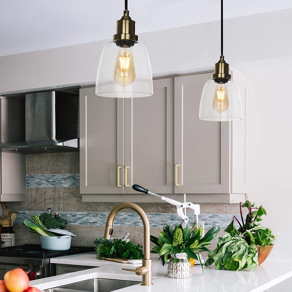 Glass pendant lights over a kitchen counter