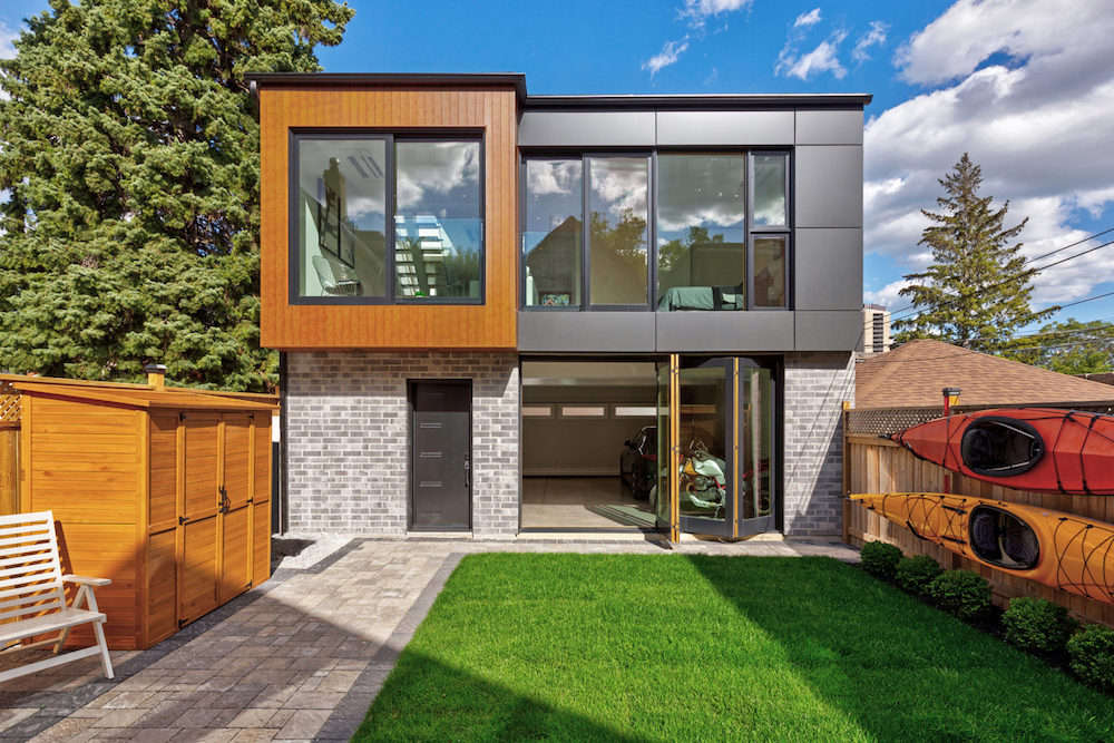 This stunning slender laneway house in Toronto features an intriguing mixed-material exterior.