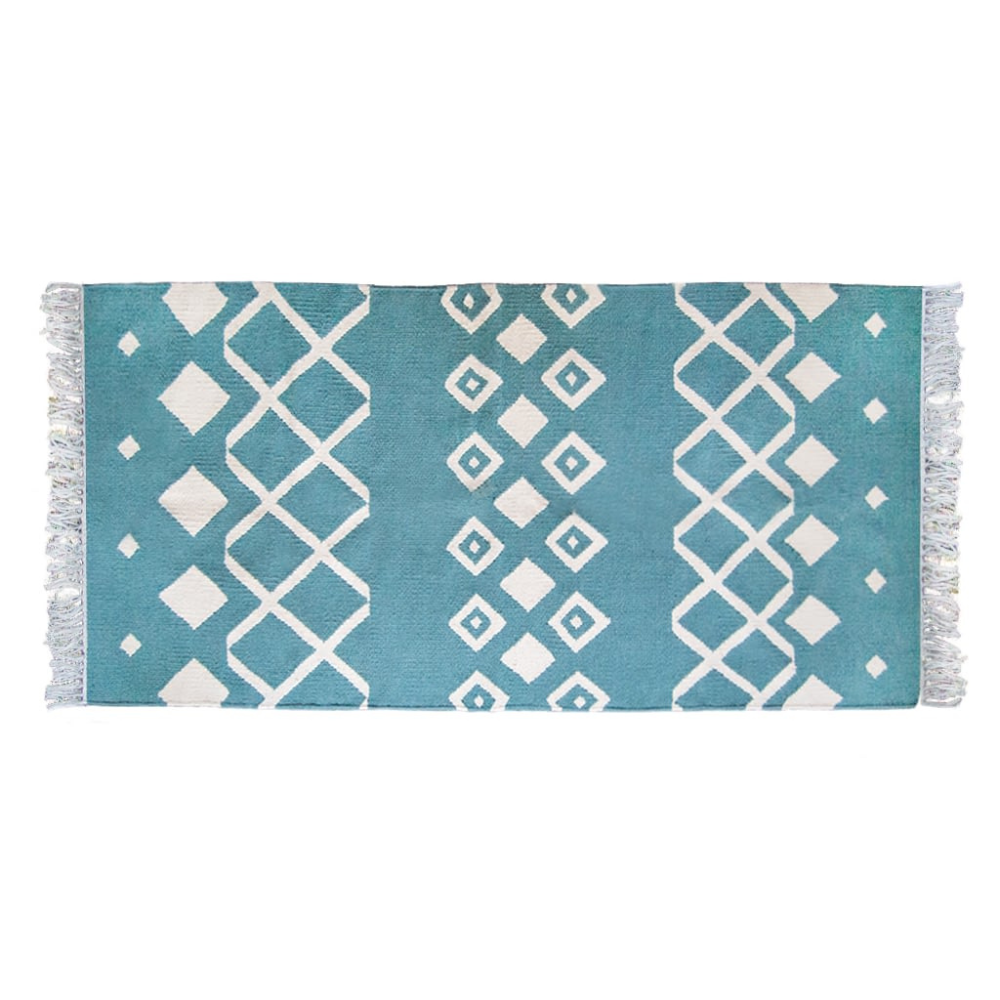 A beautiful blue and white geometric-patterned kilim rug called the Nile rug from kiliim.com