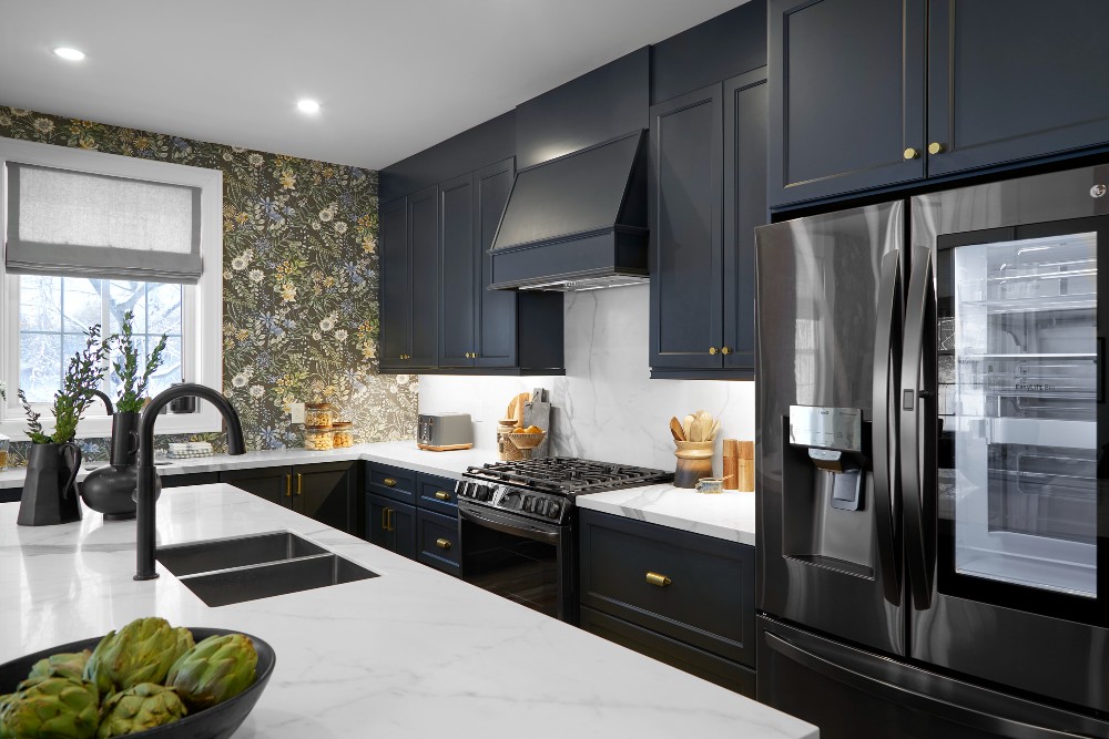 Kitchen with charcoal blue cabinetry and white porcelain countertop