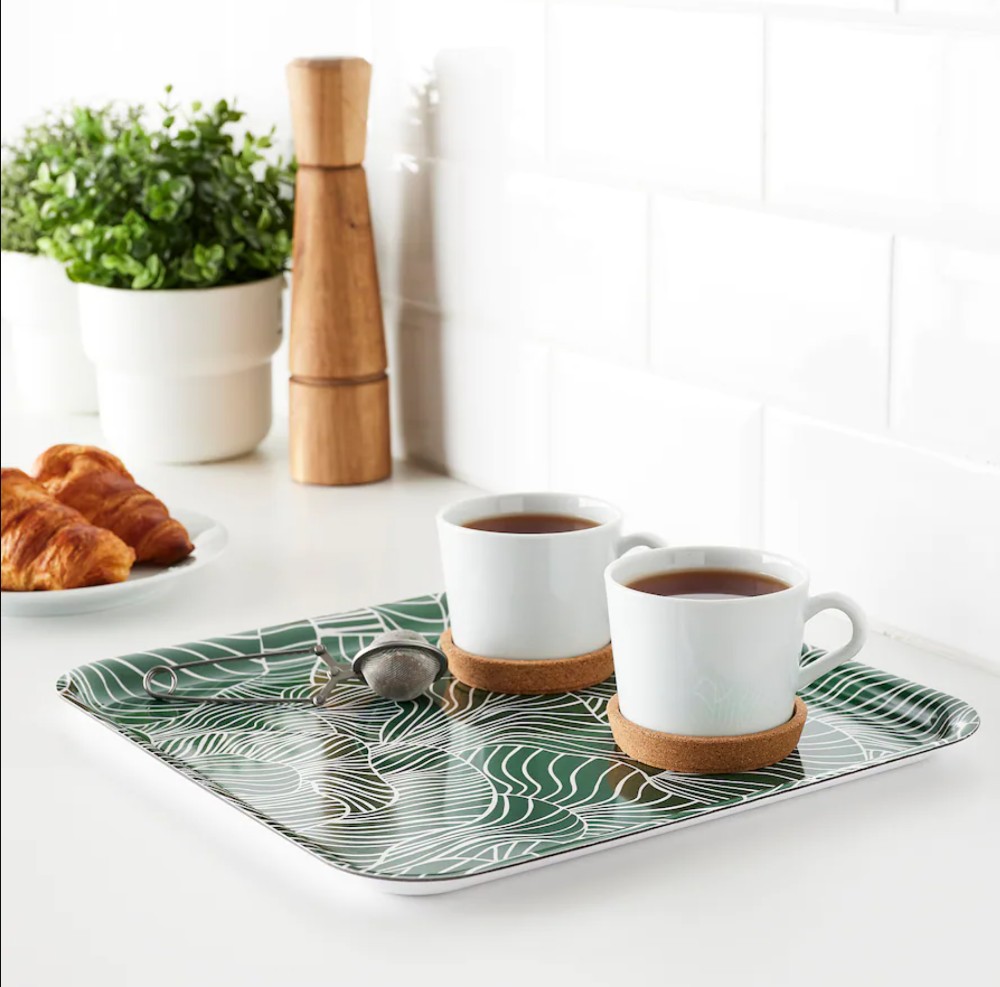Green tray with coffee mugs
