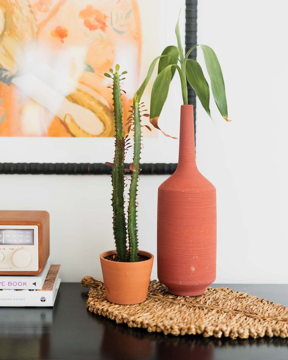Two organic vases holding plants