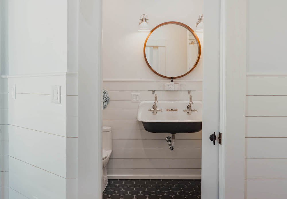 Small powder room with wall-mounted sink