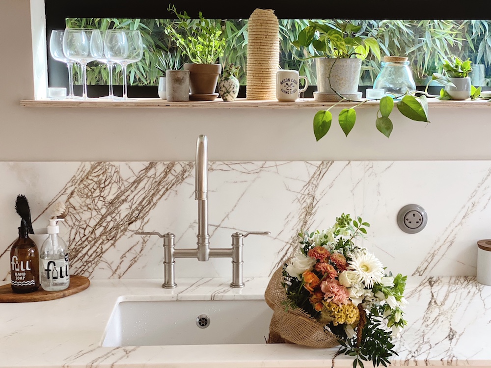 Close-up of marble sink and window
