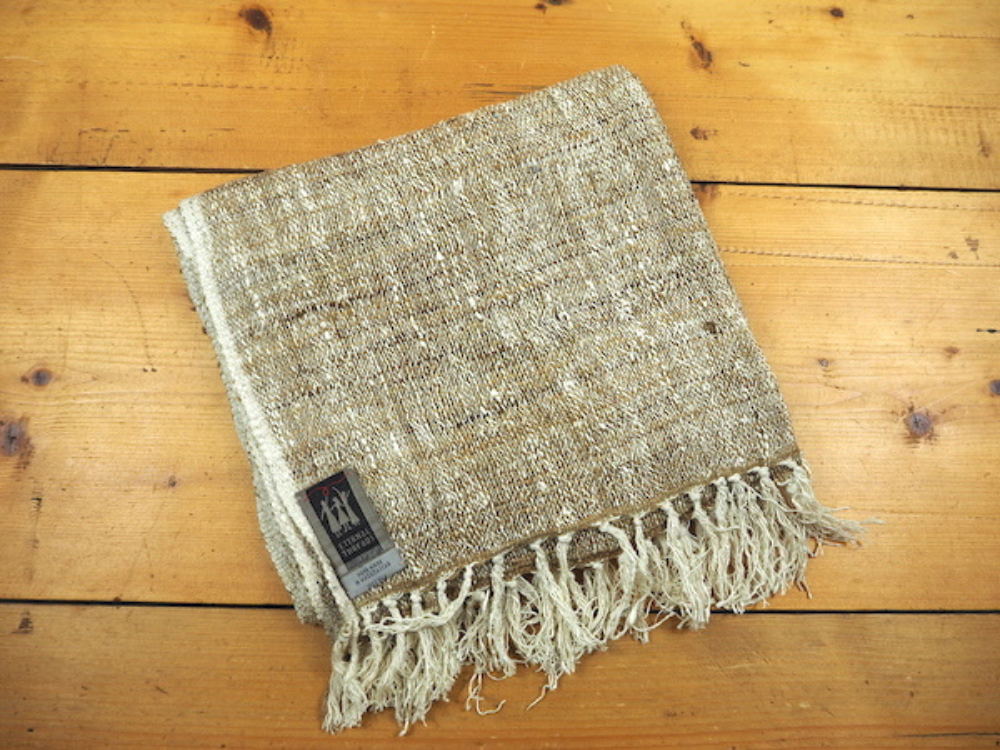 A stunning hand-woven Madagascan silk throw that sticks to a serene, earthy, neutral colour palette.