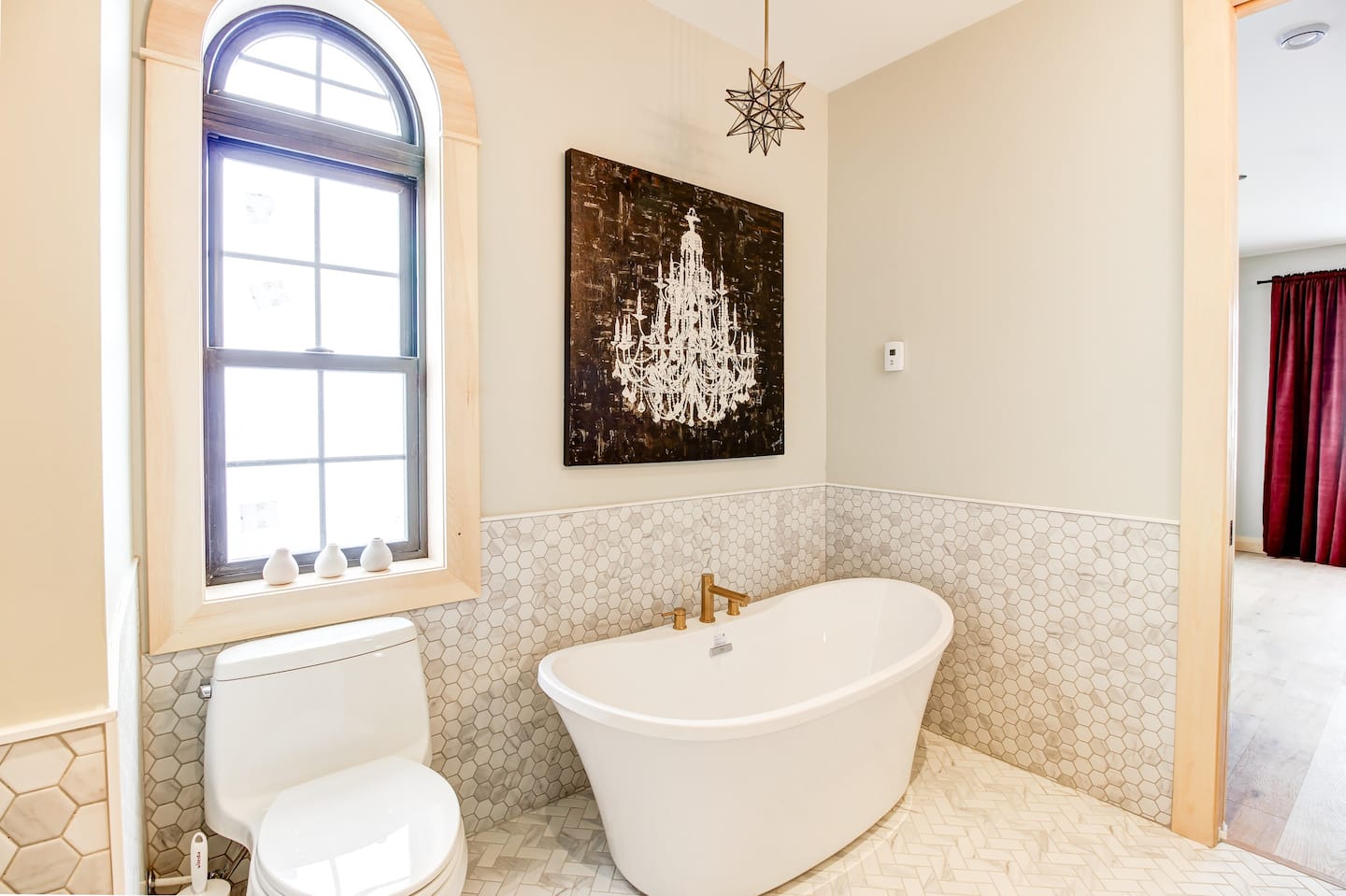 luxurious bathroom with bath tub and geometric tiles