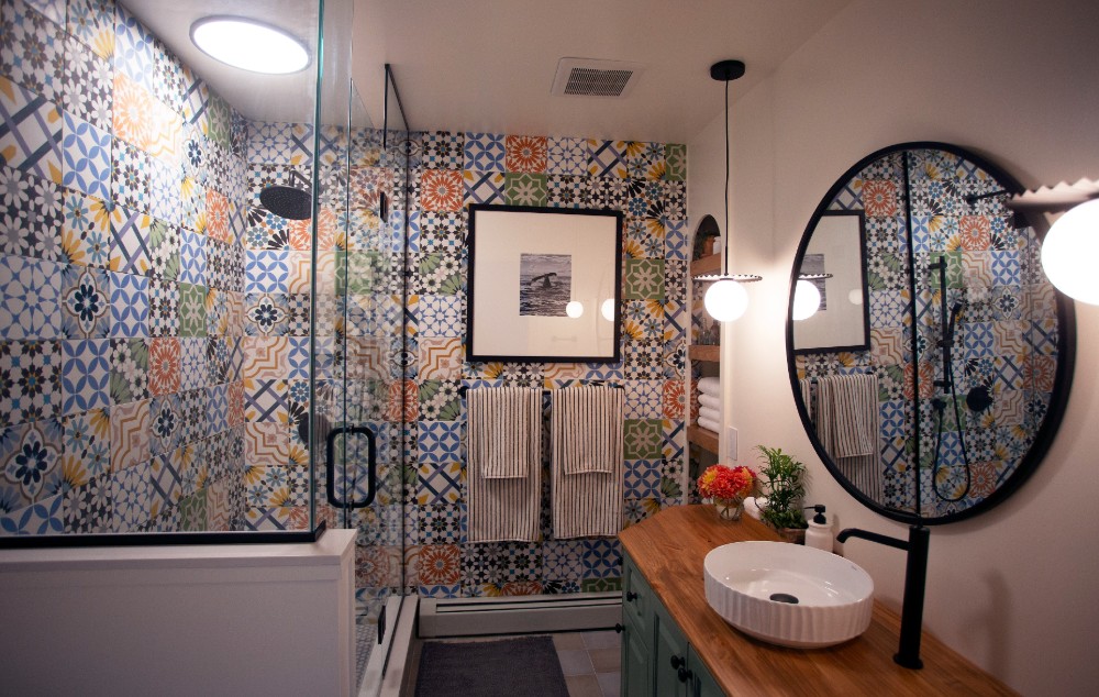 Bathroom with colourful tile and glass shower